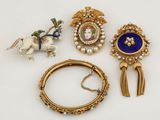 three pieces of jewelry including a broochle, a bracelet, and a broochele