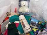 a white teddy bear sitting inside of a plastic bag