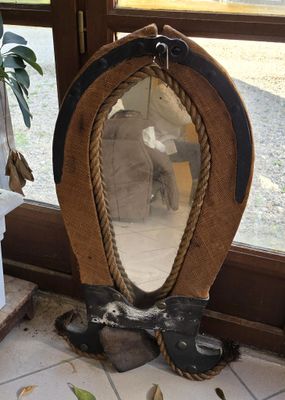 a mirror that is sitting on the floor next to a window