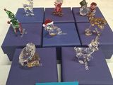 many glass figurines on display on a table