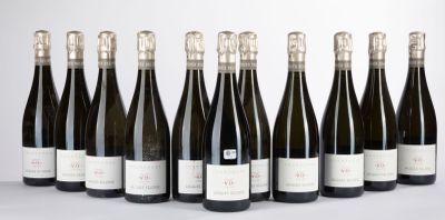 six bottles of wine lined up in a row on a table