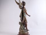 an image of a statue of a woman with a bird on her shoulder