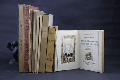 several books are stacked on top of each other on a table