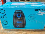 a box of a vacuum cleaner on a wooden table