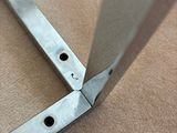 a close up of a pair of scissors on the floor