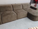 a couch that is sitting in a garage