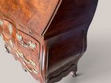a small wooden desk with a drawer on top of it