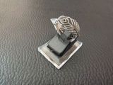 sterling silver ring with black onyxor stone on display on black leather surface