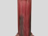 a red pedestal with a red top on a gray background