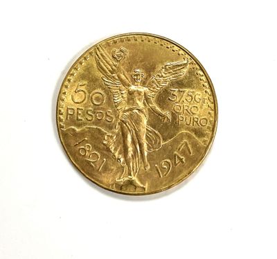 a close up of a gold coin on a white surface