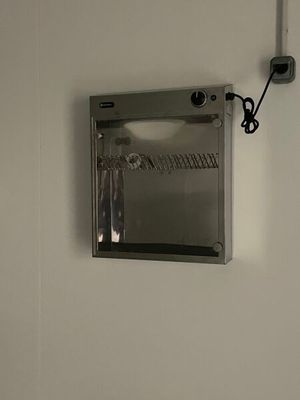 an image of a mirror mounted to the wall of a bathroom