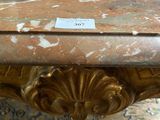 a marble table with a label on it in a room