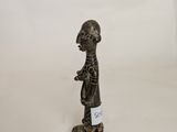 figurine of a man with a hat on his head