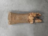 a piece of wood that has been carved into the shape of a hand