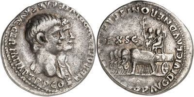 a silver coin with an image of a man on a horse