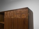 an image of a wooden cabinet with carvings on it