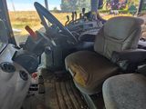 a view of the inside of a truck from the driver ' s seat