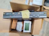 a box of electronic equipment sitting on top of a cardboard box