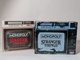 two games on the table and one is a monopoly stranger and the other is a stranger stranger