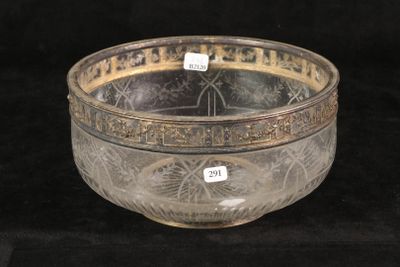 a glass bowl that is sitting on a black surface