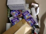 a cardboard box full of toilet paper and other items