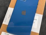 a blue iphone is sitting on top of a cardboard box
