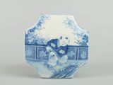 a blue and white vase with a woman and a dog on it