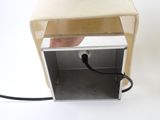 a hand that is plugging in to a box
