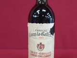 a bottle of wine that is sitting on a table