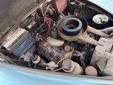 an old car engine with a lot of rust in it