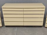 a set of three white dressers and two nightstands
