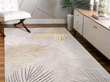 a rug that has a palm leaf design on it