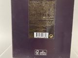 the back of a purple box with a black label on it