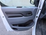 a door open of a white van with the door open