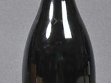 a bottle of wine that is sitting on a table