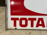 a red and white sign with the word total on it