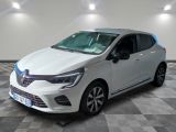 a white car is parked in a room with a checkered floor