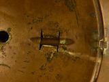 a close up of a metal object with a hole in it