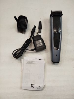 an image of a hair clipper and a hair brush