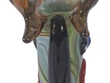 a glass vase with a moose head on it ' s head