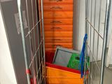 a metal cart with many boxes on it in a room