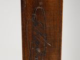 an image of a close up of a wooden object on a white surface