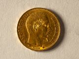 an image of a gold coin with a man ' s face on it