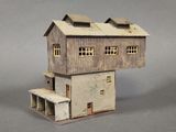 a small model of a house with two windows and a porch