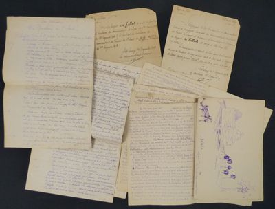 several old handwritten papers are piled on top of each other