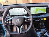 the interior of a car with a steering wheel and dashboard