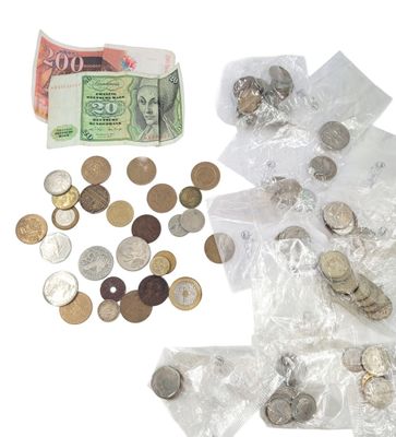 a bag of coins and a bunch of money on the table