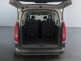 two seats in the back of a van with the door open