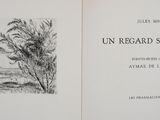 an open book with a drawing of trees on it