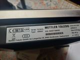 a label on the back of a laptop that says mettler toledo